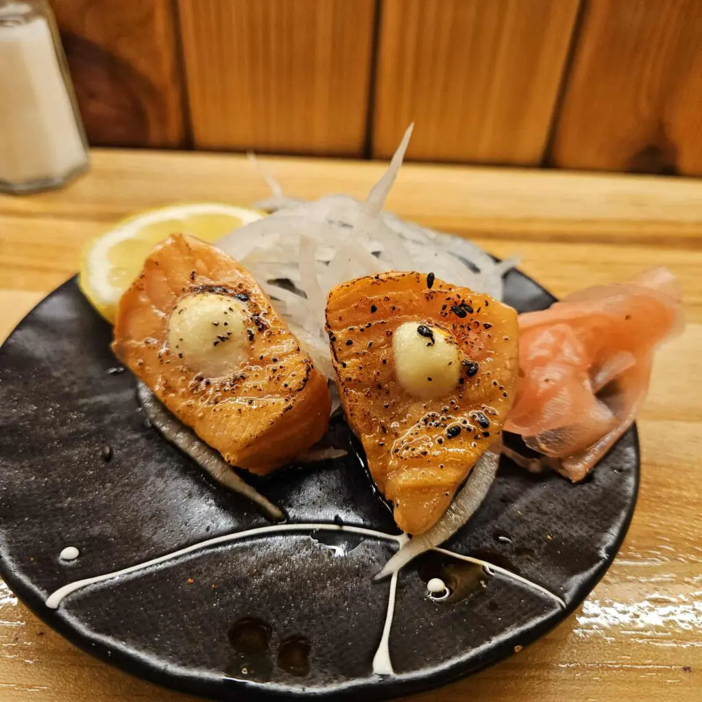 At Ichiro Izakaya Yakitori Diner and Bar, the seared salmon balances a tender center with smoky edges from the grill. (Photo by Edward Brown)