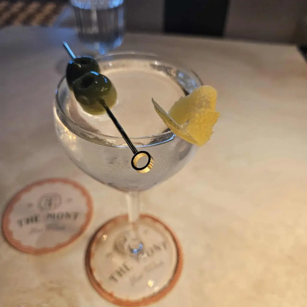 The Freezer Martini at The Mont is a crisp blend of Botanist Gin, Carpano dry vermouth, bitters, and lemon peel. (Photo by Edward Brown)
