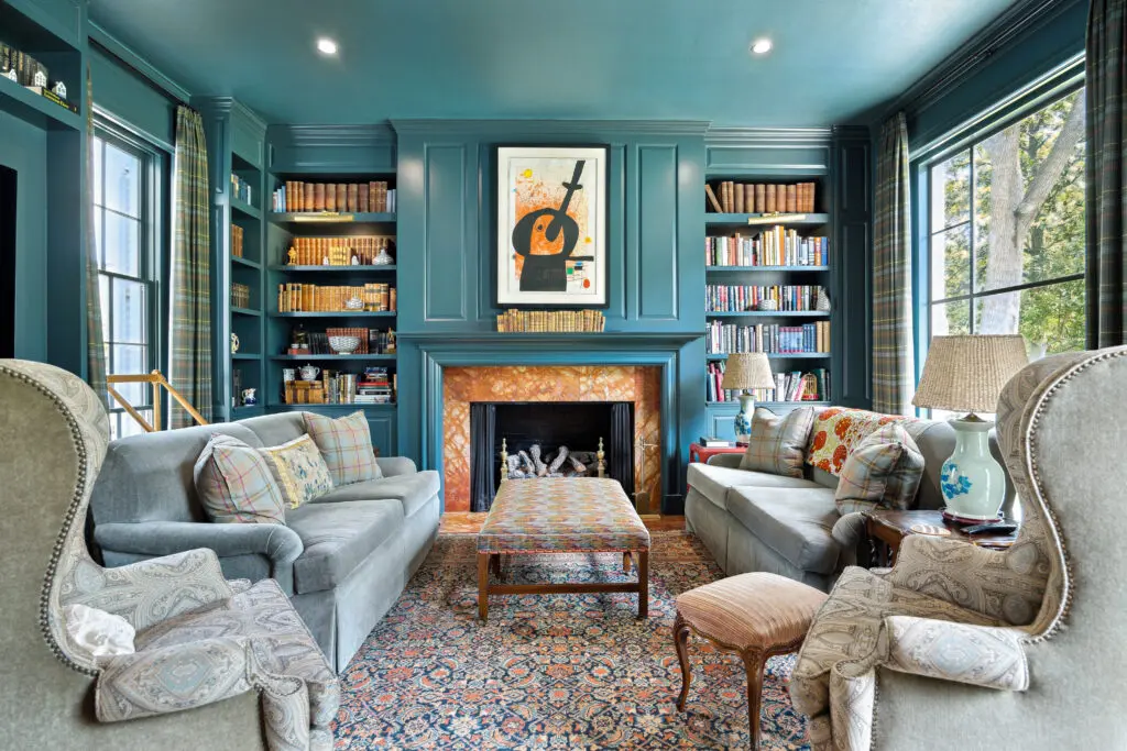 The comfortable library of  4019 Inverness shows the style of this legendary renovated River Oaks mansion,