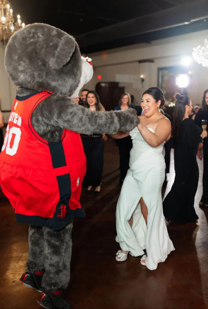Clutch, the mascot of the Houston Rockets, was a surprise guest on the dance floor at this wedding,