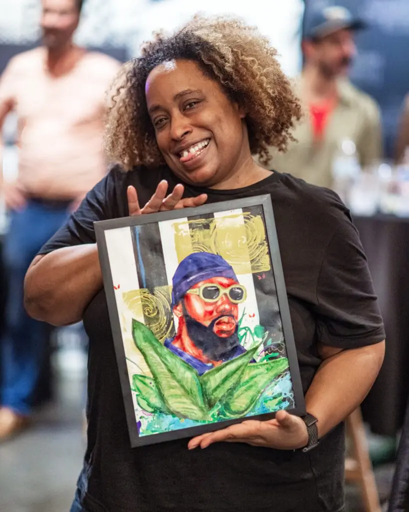 LaShawnda Mayhorn with art by Brian Dickson Jr. (Photo by Walt Burns)