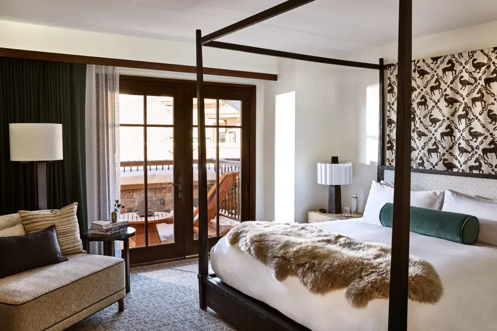 Stylish guest rooms and residences blend alpine comfort with Auberge polish. (Photo by Auberge Collection)