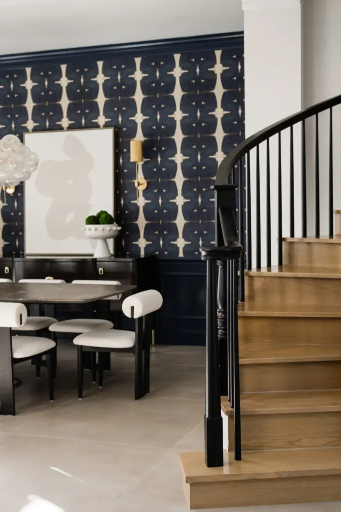The staircase at this Grogan's Point home in The Woodlands was redesigned with lighter treads and risers and black accents on the handrail and balusters.