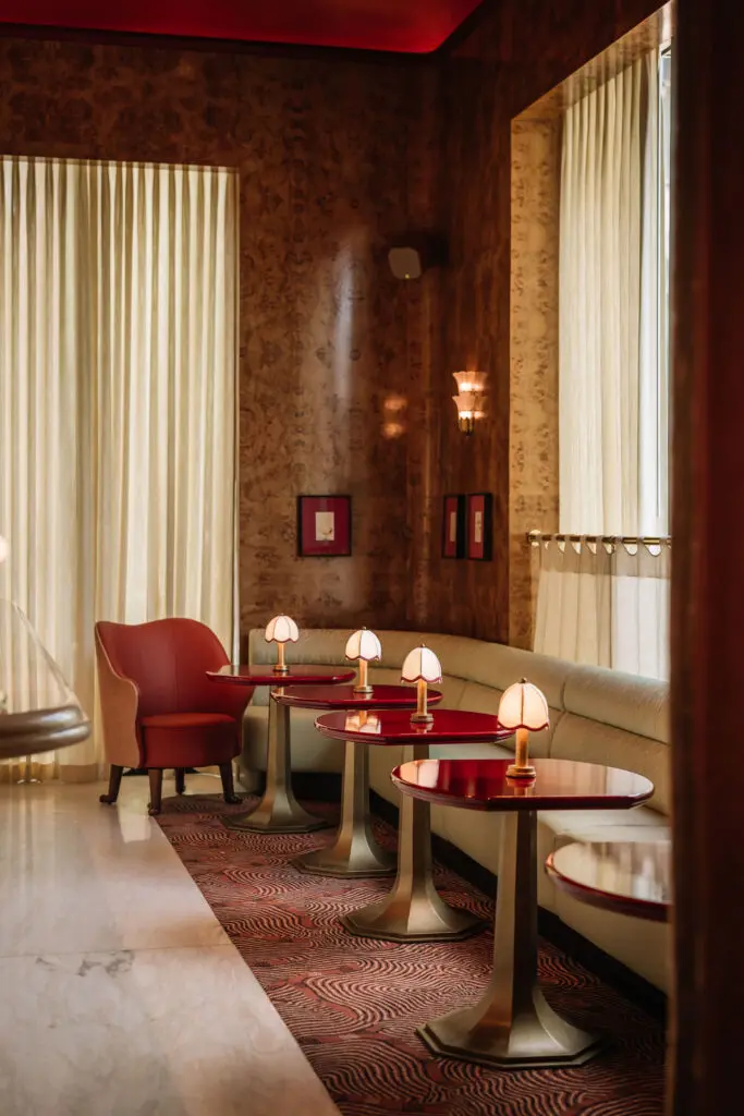 The Mamani space includes a beautiful bar clad in rich burl paneling and fitted with an onyx niche for bottles and glassware behind. (Courtesy)