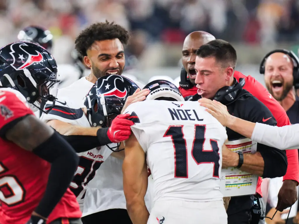 His Houston Texans teammates celebrated rookie Jaylin Noel's huge kick return. (Photo by F. Carter Smith)