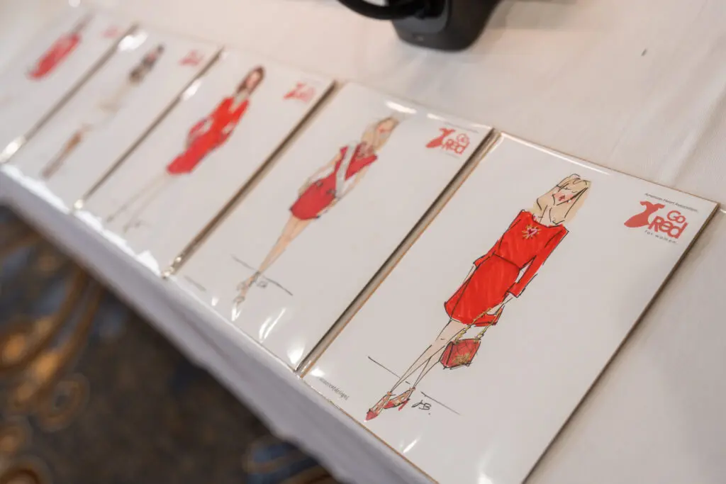 Fashion sketches for guests at Dallas Go Red for Women Luncheon (Photo by See Pink, Inc)