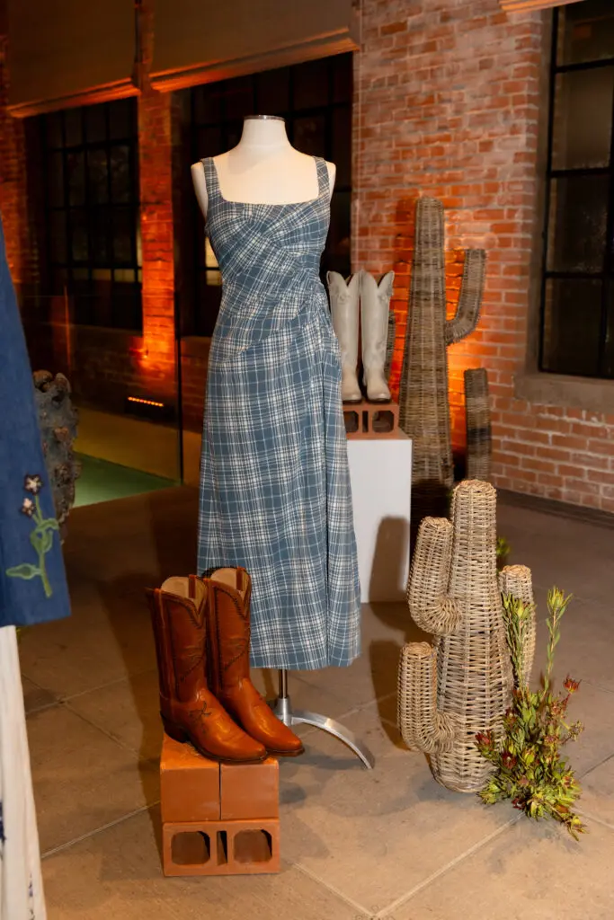A pair of boots and dress from the Lela Rose x Lucchese collection. (Photo by Kaitlin Saragusa Photography)