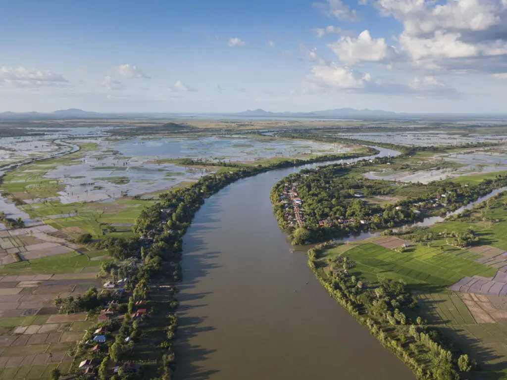 Aerial of Tonle Sap river, village and rice fields, Kampong Prasat, Kampong Chhnang, Cambodia. (photo courtesy of Aqua Expeditions)