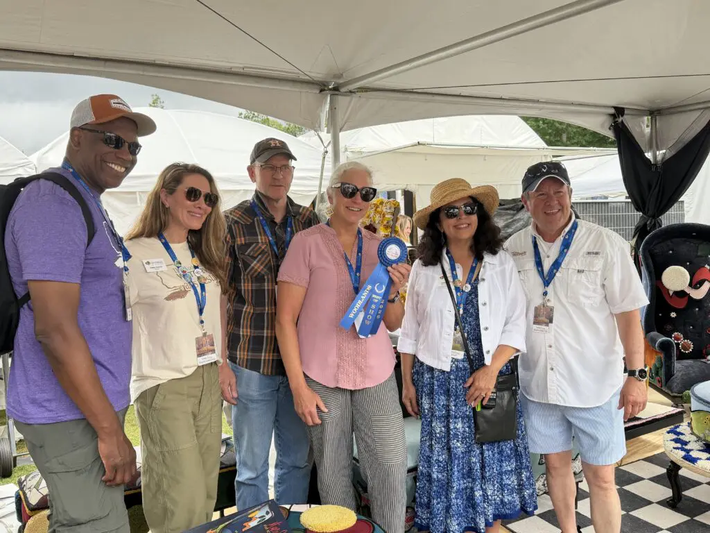 Ted Harris, Haley Garcia, Mary Beth McGinnis and her husband, Jenny Carattini-Wright and Nick Wolda. McGinnis, a Houston-based fiber artist, won Best of Show in Fiber at the 2026 Woodlands Waterway Arts Festival. (Photo by Laura Landsbaum)