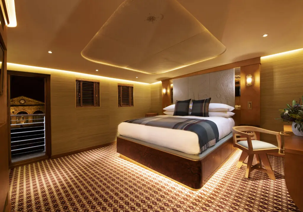 The ship turned boutique hotel was meticulously designed by the award-winning team behind the iconic Royal Yacht Britannia with sleek polished wood finishes, spacious emerald tile bathrooms and plush beds.