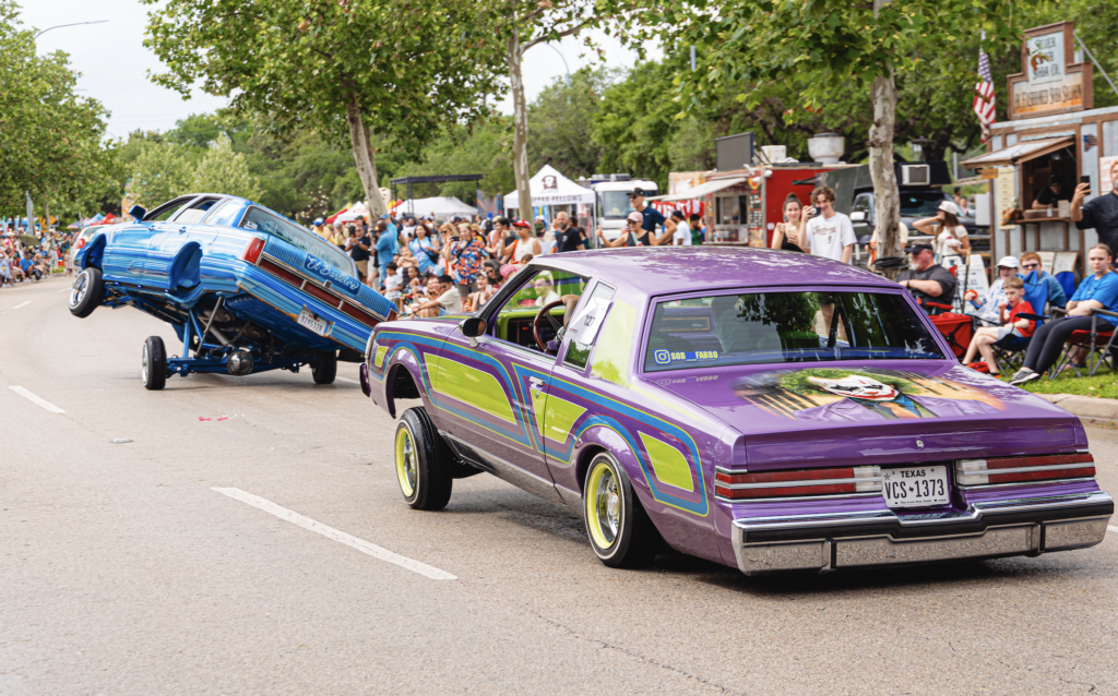 “El Bandolero” by El Bandolero and Class Consulting VS and “Ruthless Villain” by Fabian and Juju and Classic Consulting VS at the Orange Show’s 39th Annual Art Car Parade. (Photo by Mike Herrera)