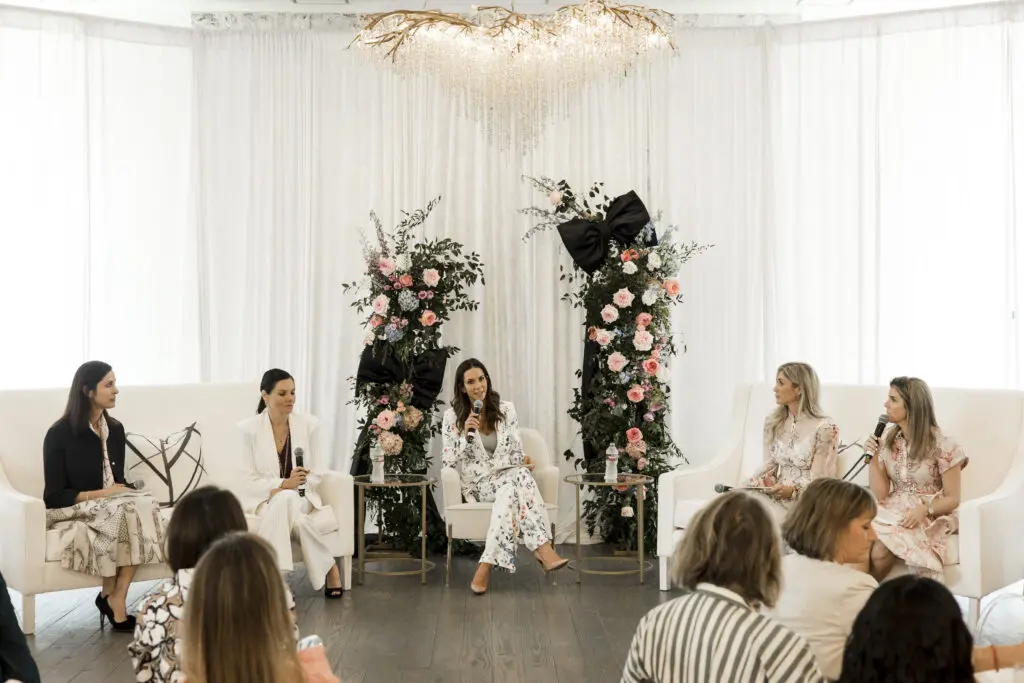 The panel of speakers gathers at The Peach Orchard during Interfaith Community Clinic’s Women Empowering Women event. (Photo courtesy Porterhouse Portraits)