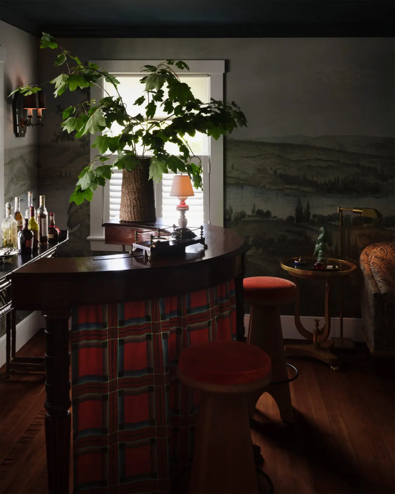  A vintage tartan fabric is used as a skirt for the antique English hunt bar. (Photo by Douglas Friedman) 