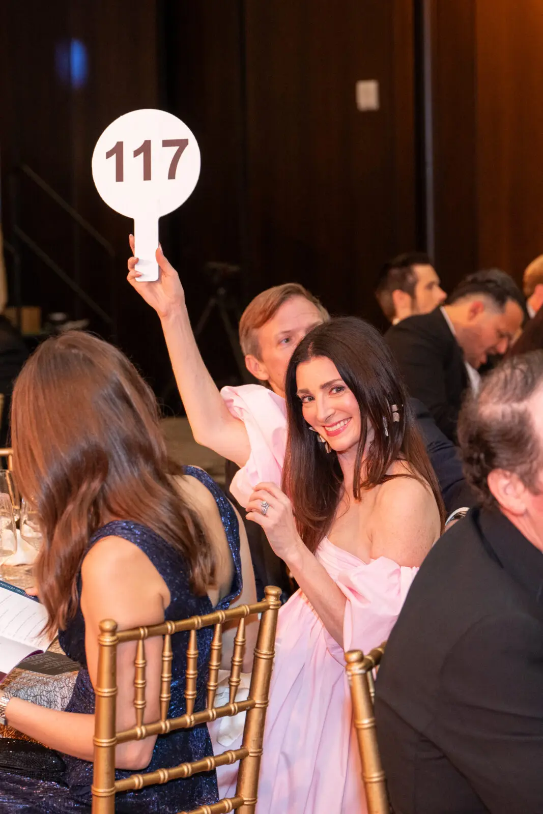Paddles up at the Alley Theatre gala (Photo by Tasha Gorel) 