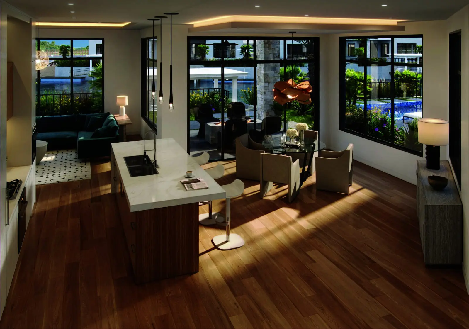 The architecture is coastal contemporary in the truest sense: clean volumes, natural materials, relaxed textures and open floor plans that blur the line between interior space and the water beyond. 