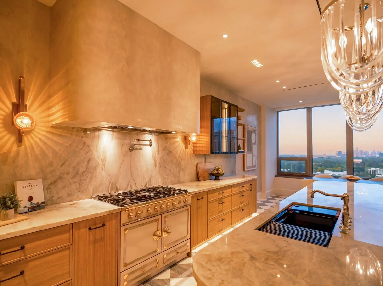 The chef's kitchen in the Belfiore penthouse is outfitted with the exceptional Gaggenau and La Cornue appliances (Photo by Harry Stonhill)