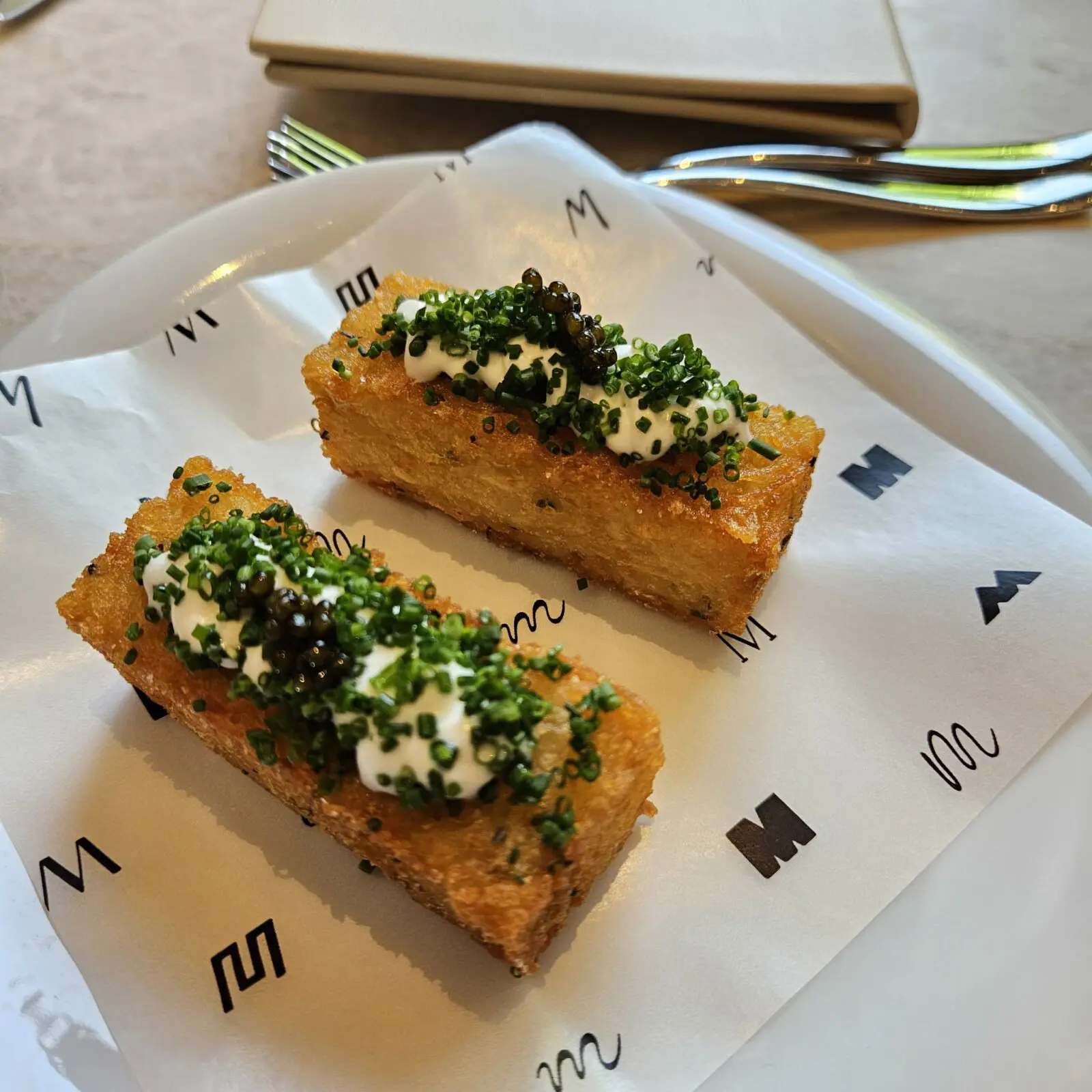 On a recent visit to Café Mirador,
Chef Manuel “Manny” Gutierrez surprised us with an off-menu delight: fried potato squares topped with crème fraîche, finely diced chives, and a dollop of caviar. (Courtesy)