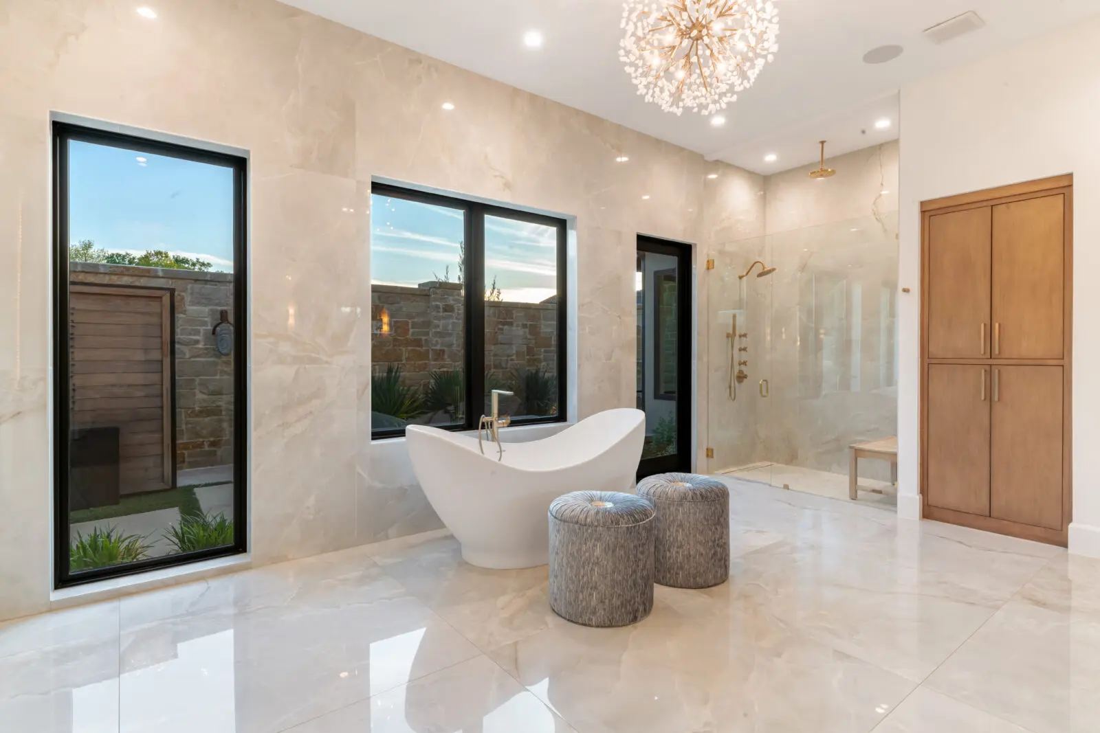 The large spa-like bathroom in the primary suite (Photo by Costa Christ / Compass)