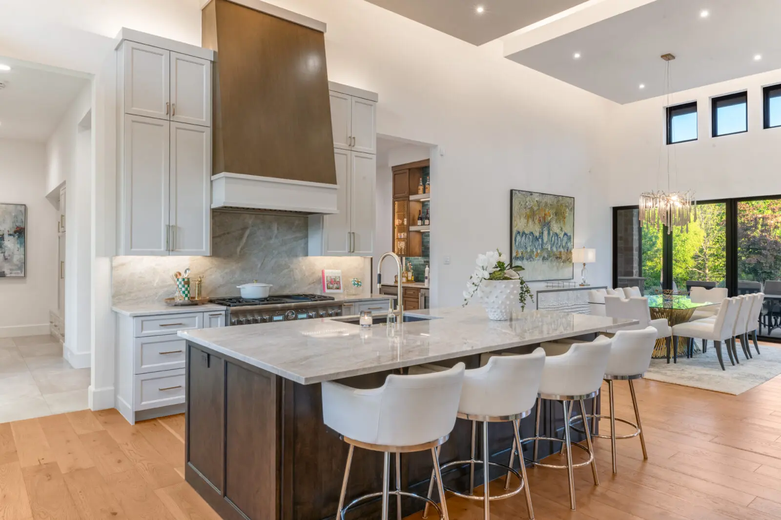 The home's epicenter and gathering point, the chef's kitchen features custom millwork with elevated finishes. (Photo by Costa Christ / Compass)
