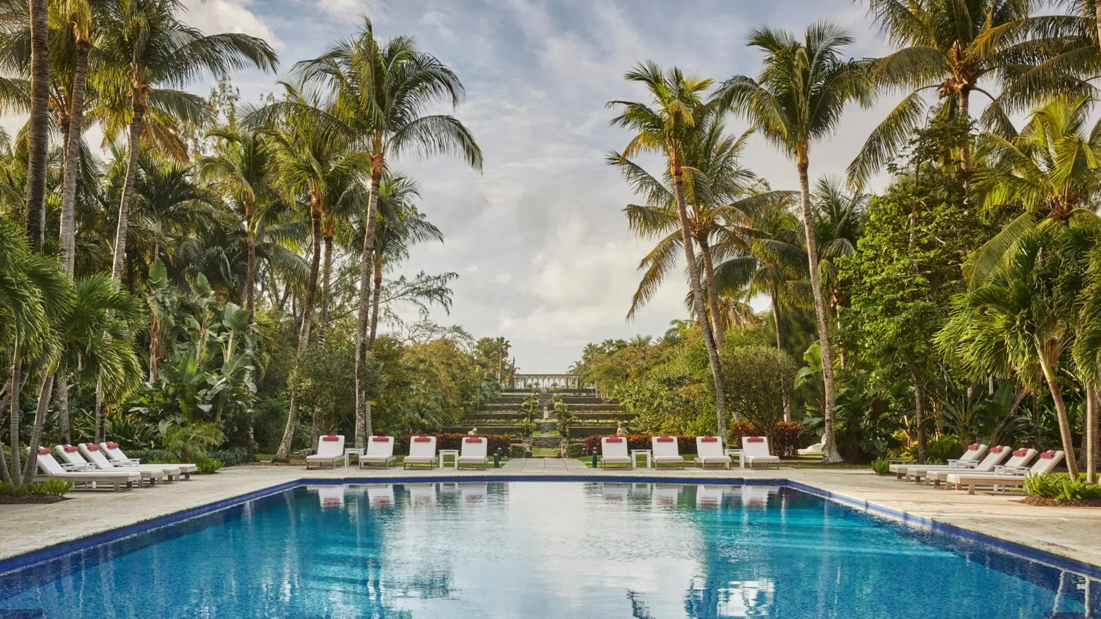 The serene adults-only pool at The Ocean Club overlooks the iconic Versailles Gardens.