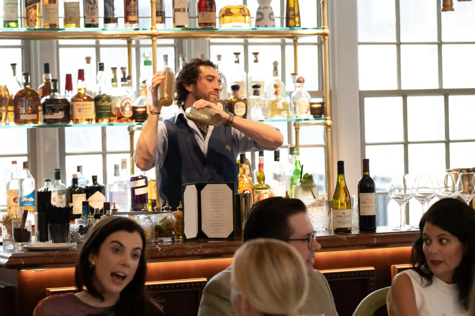 A Mister Charles bartender mixing cocktails. (Photo by George Fiala Photography)