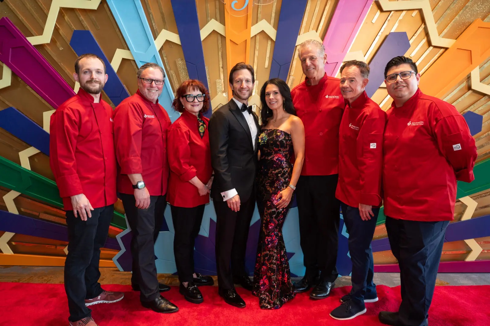 Chefs Jason Rohan, Dan Landsberg, Janice Provost, with Chairs Chris and Jennifer Clark, and Chefs Richard Chamberlain, Gerard Thompson, and Miguel Antonio. (Photo by See Pink, Inc)