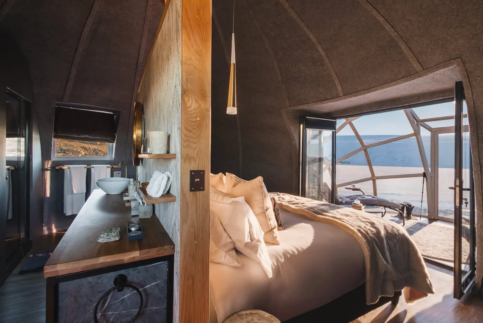 Whichaway Camp features warm interiors with rich textures and fur throws, inspired by the golden age of exploration