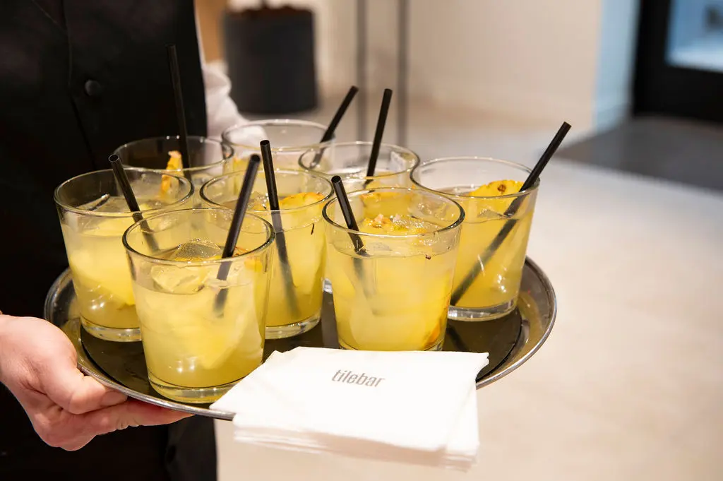 Guests enjoyed cocktails as they toured the showroom, gathering inspiration. (Photo by Tamytha Cameron)