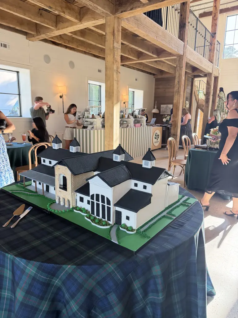 Cakes by Gina created an extraordinary cake resembling the Blue Magnolia venue for the opening of Magnolia Stables. (Photo by Laura Landsbaum)