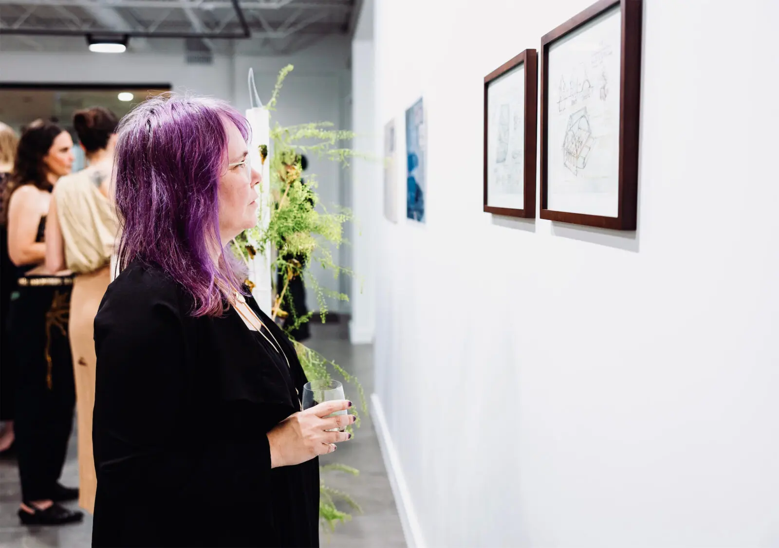 Tracy Jo Barnhardt takes in Mel Chin's "Living Score" at the Houston Arts Alliance Gilded & Golden Kickoff (Photo by Hung L. Truong)