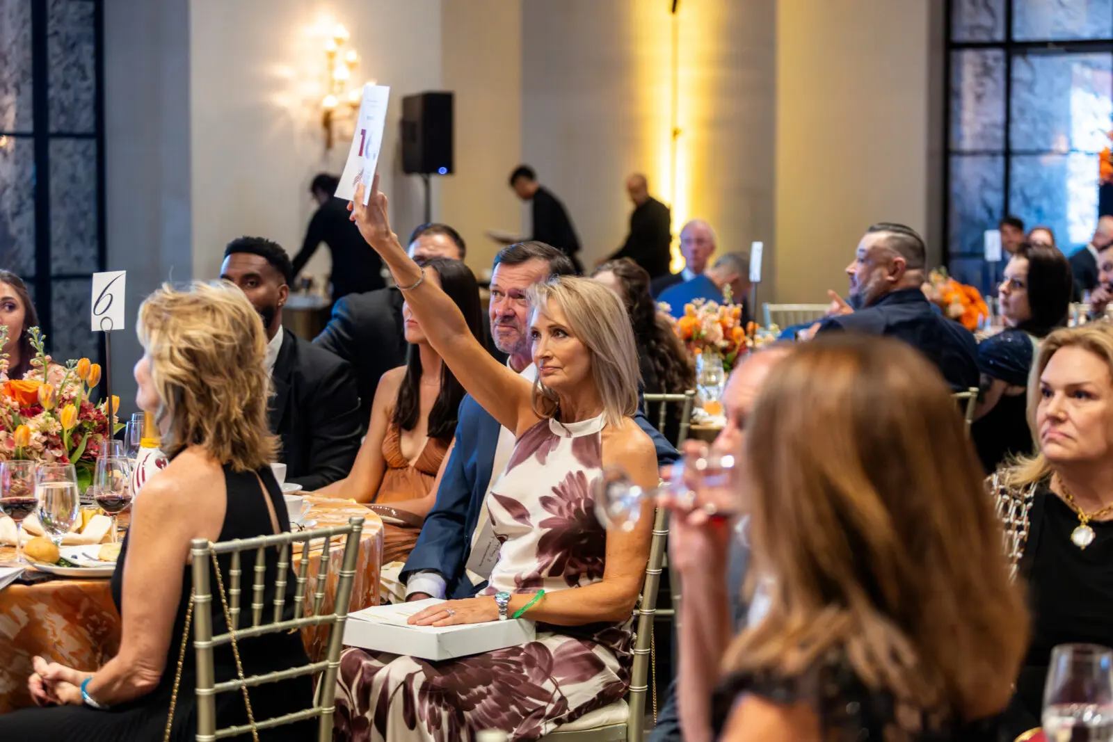 Bidding on the live auction at the Petra Cares million dollar fundraiser.