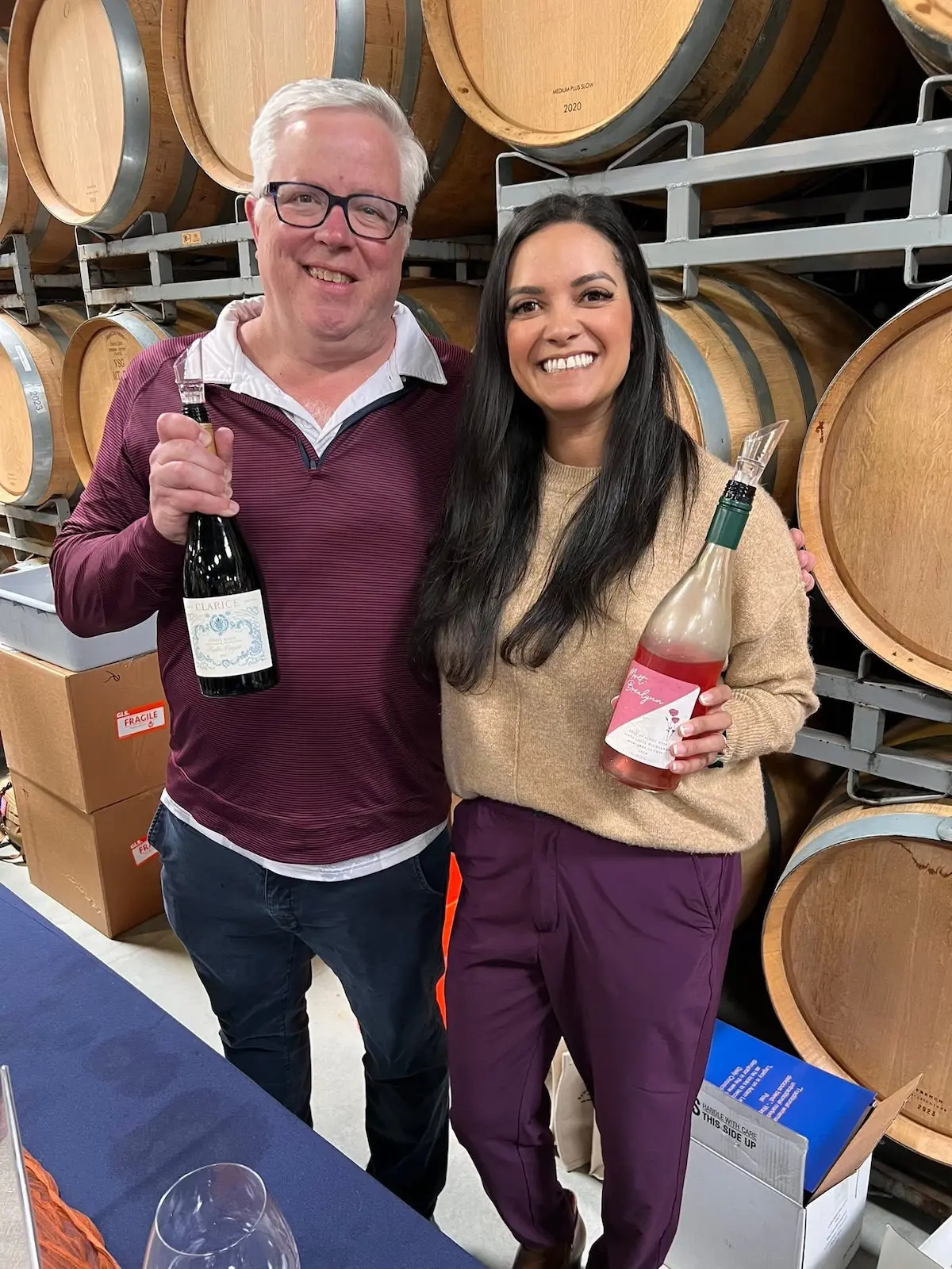 Adam Lee and Morét Brealynn pouring at a wine festival in the Santa Lucia Highlands.