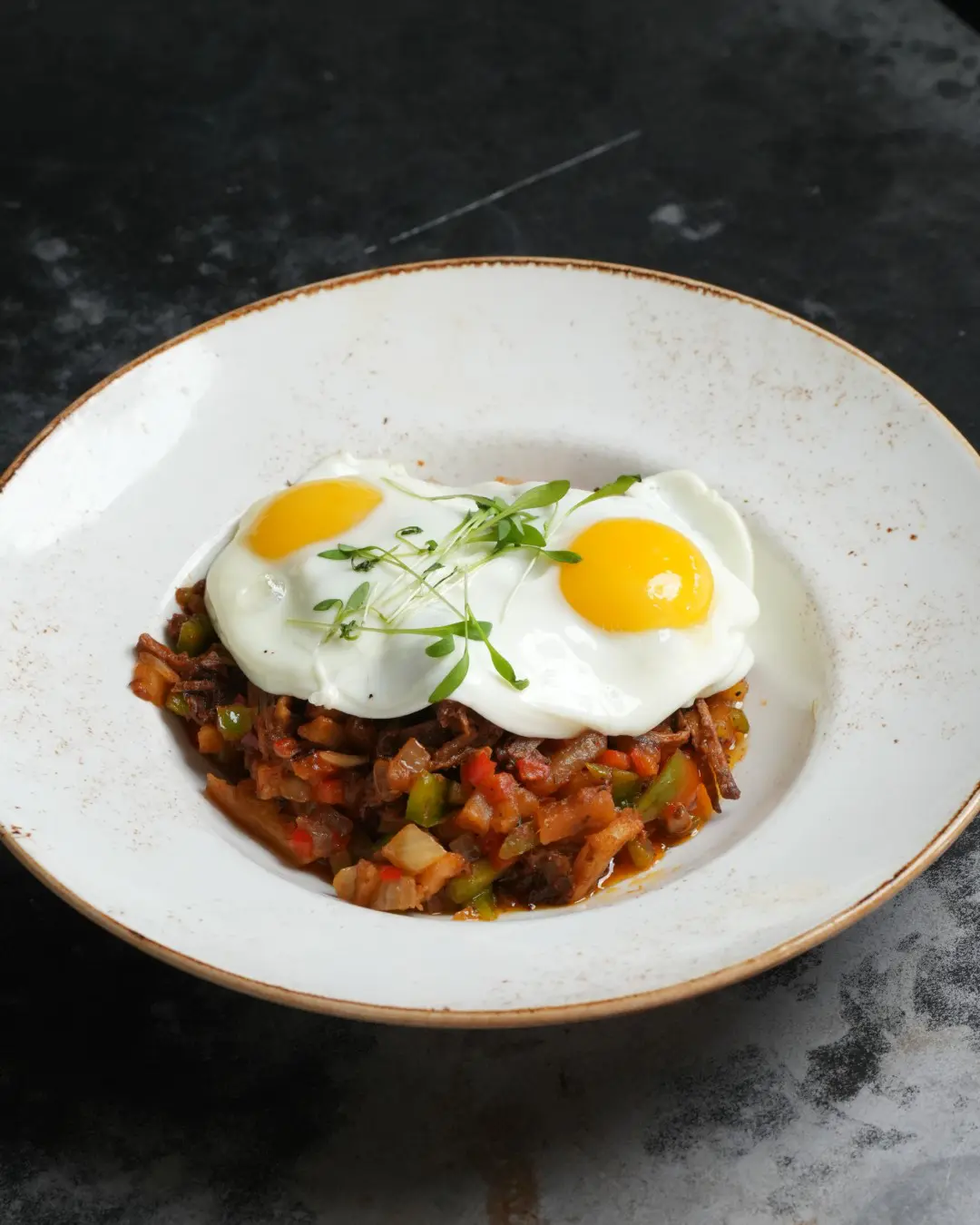 Weekend brunch at State Fare includes everything from Birria Benedict and chicken fried steak and eggs to sweet griddlecakes. (Photo courtesy State Fare)
