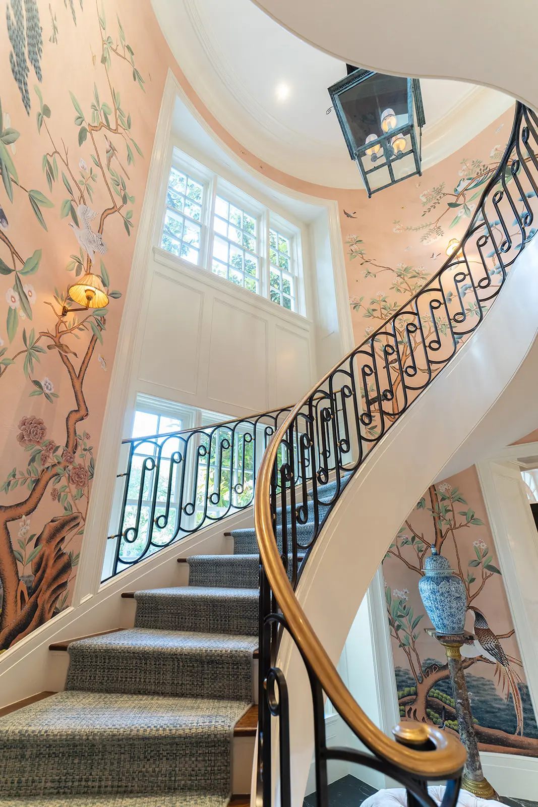 The showstopping staircase in the Hollywood Regency-style home (Photo by Clark Cabus)