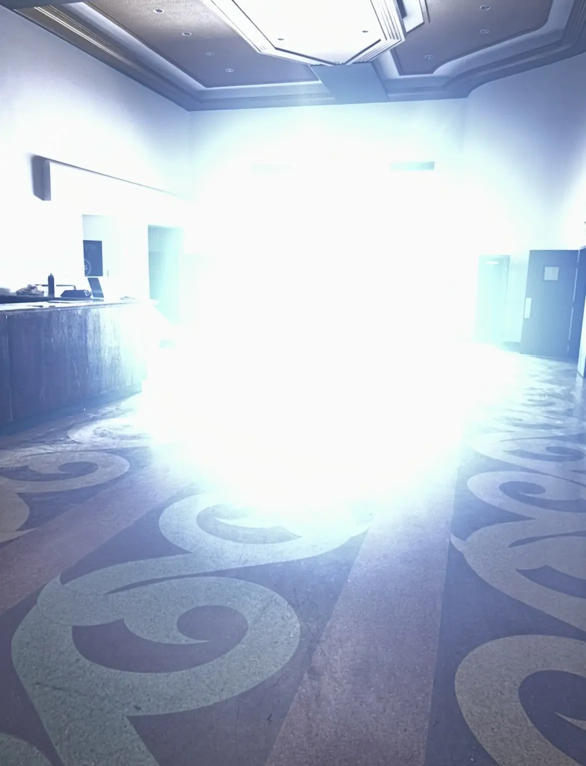 A brilliant flare of light casts the Garden Oaks Theater in an otherworldly glow.
(Photo Credit: Alison Medley)