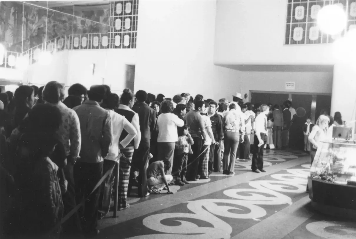 Moviegoers stream into the Garden Oaks Theater lobby during its heyday.