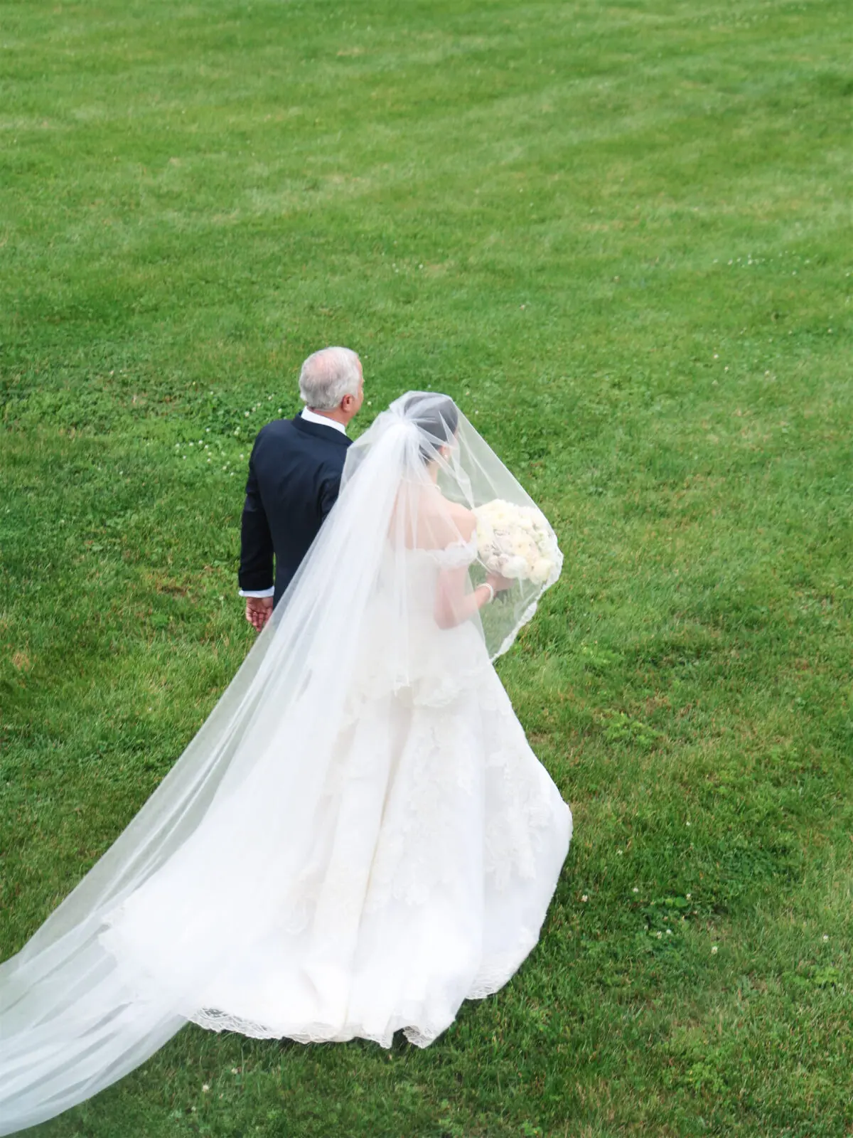 The bride's father walks her down the aisle (Photo by The Browns)