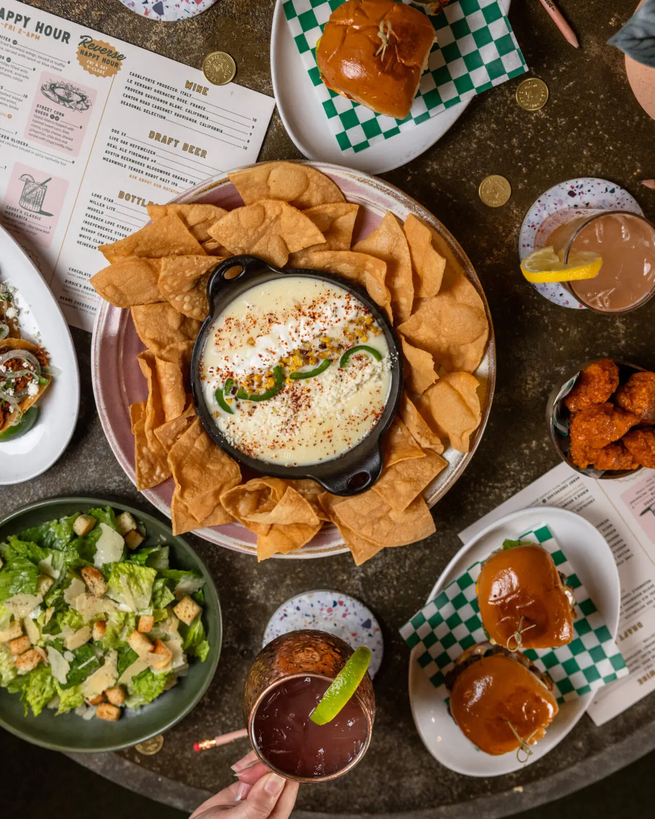 The new menu at The Dirdie Birdie features Bang Bang Porcorn Shrimp, humus, tostadas, short rib, and other elevated bar food selections. (Photography by Consumable Content)