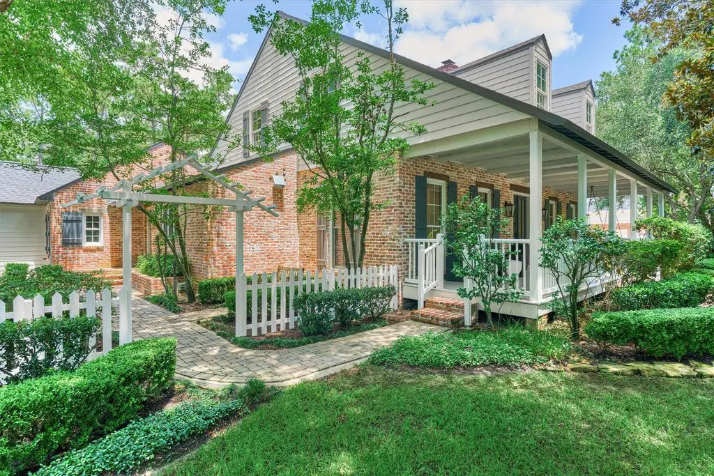 A porch and veranda in the front at 64 Autumn Crest is warm and inviting.