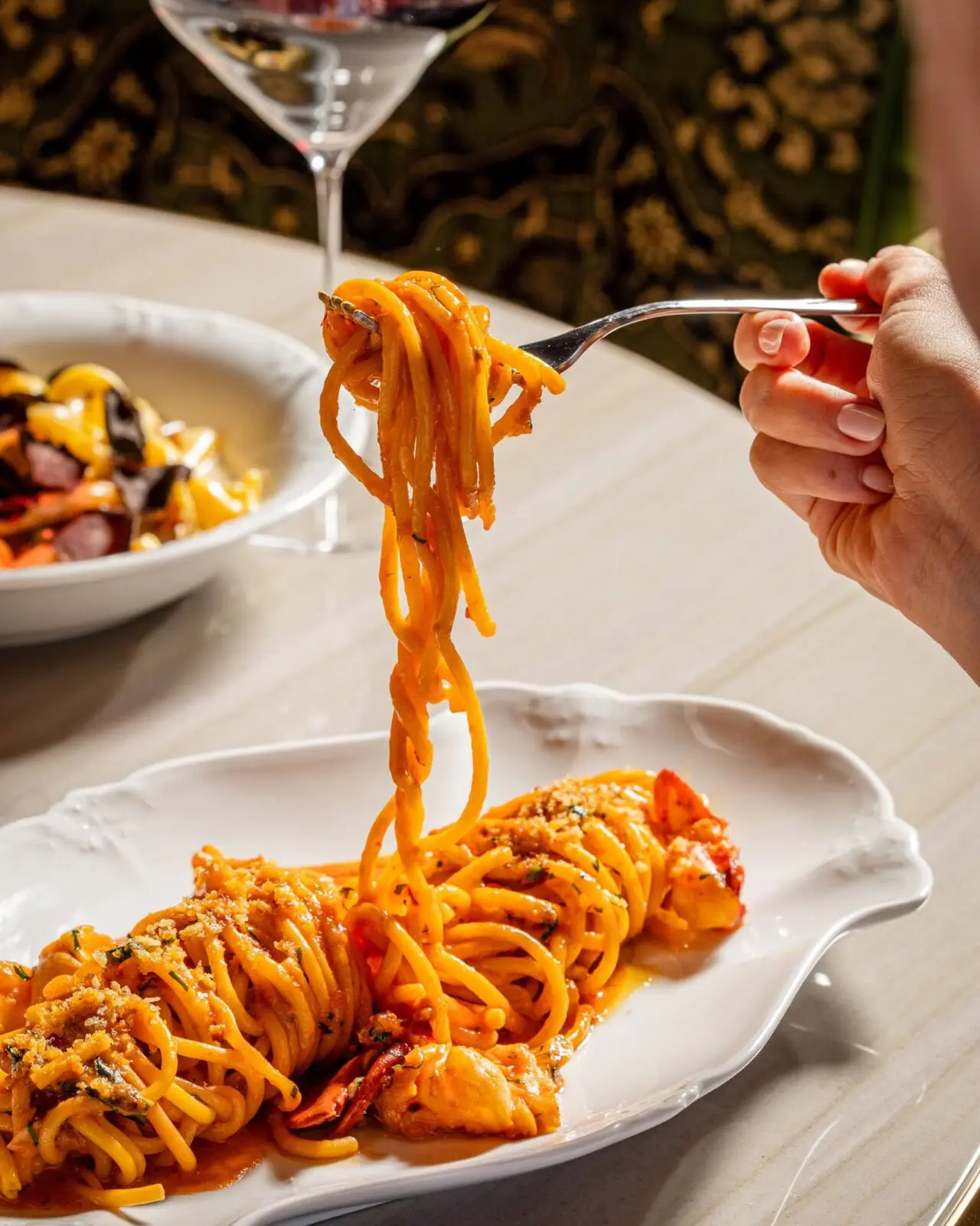 Lions Den offers house-made pasta dishes like bucatini, tagliatelle, and agnolotti. (Courtesy)