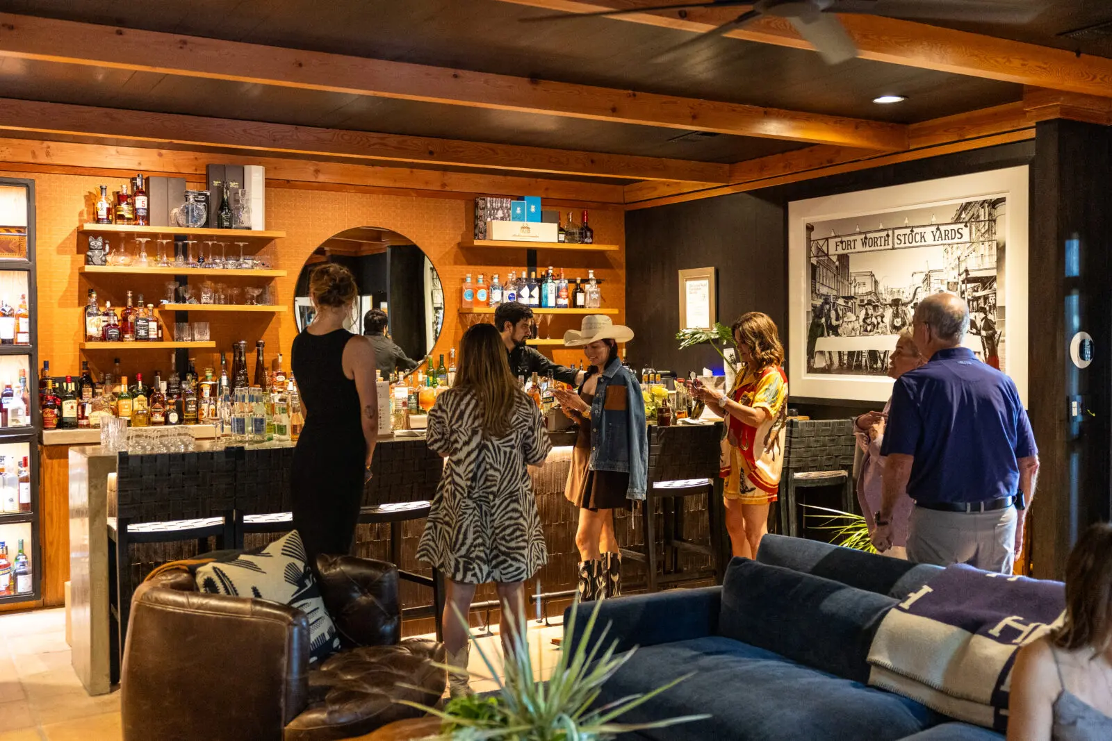 The home's bar served as a gathering place throughout the invitation-only weekend. (Photo by Land Rover Fort Worth)