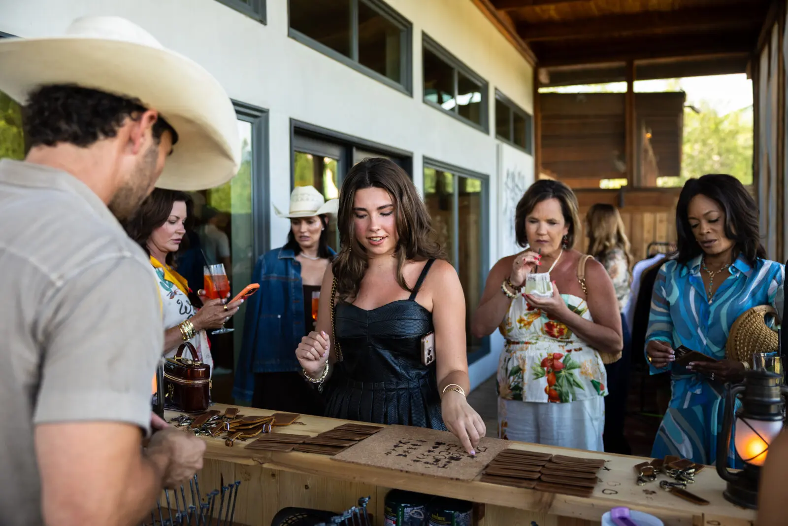 Guests personalized complimentary leather goods during the weekend's custom branding activation. (Photo by Land Rover Fort Worth)