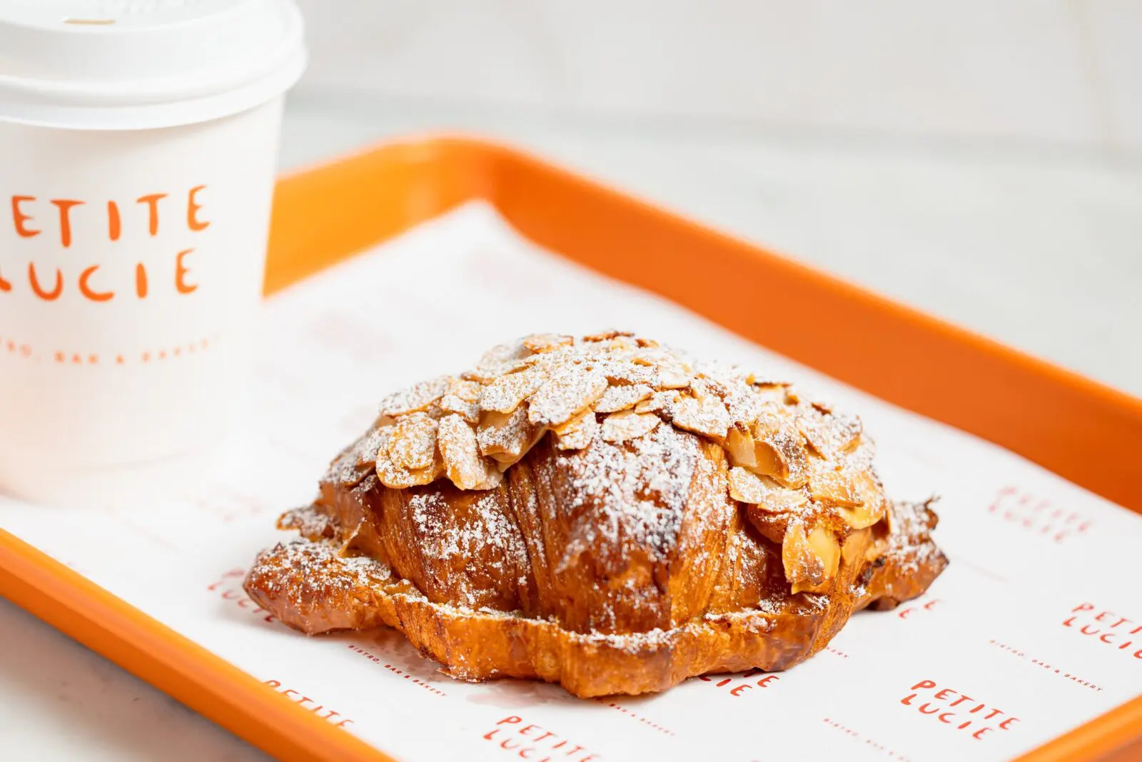 Omar Pereney’s warm, flaky croissants and pastries are served up every morning fresh from the oven at Petit Luice. (Photo by Mariela Callaway)