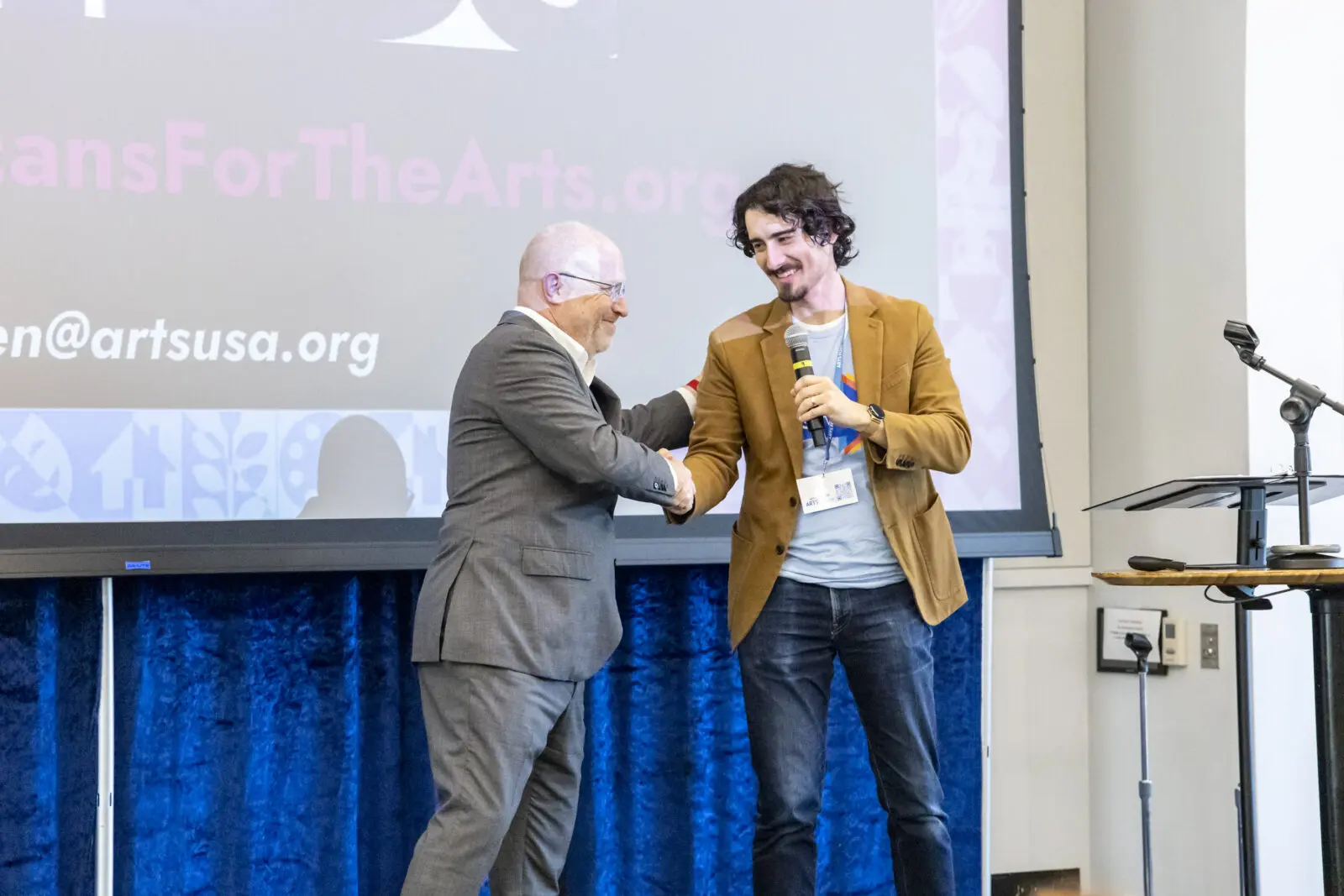 Wesley Gentle (right) greets Americans for the Arts' Randy Cohen at ARTSforward. (Photograph by Julien Lambert)