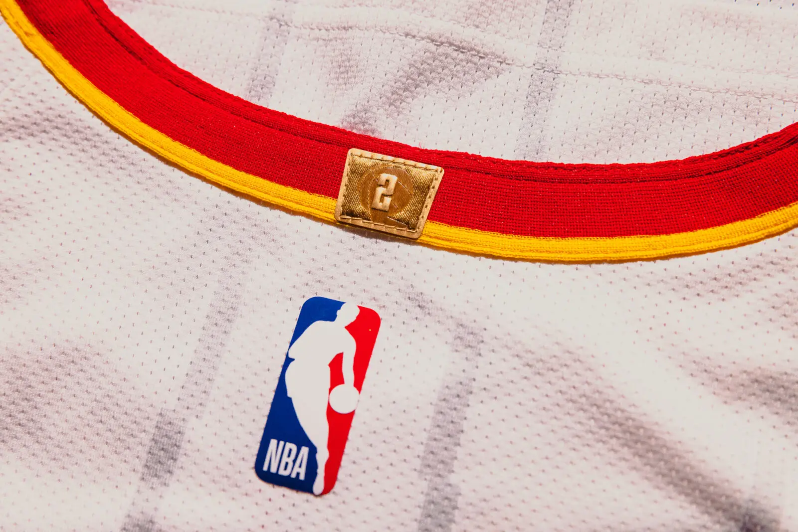 The Houston Rockets' new uniforms pay homage to the two championships with a patch on the back.