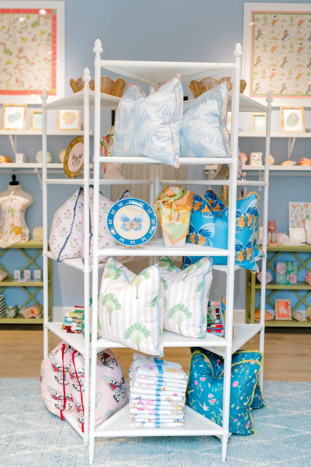 Powder blue walls, pastel accents, and Cartie's watercolor-inspired home décor transform the temporary Clearfork boutique into an immersive extension of her artwork. (Photo by Canon Sawyer)