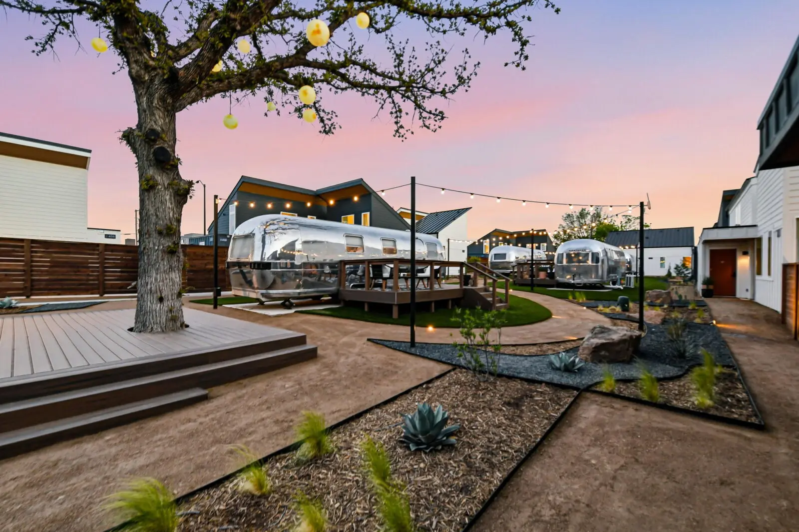 Custom Airstream suites surround Hotel SOMA's central courtyard, offering a distinctive lodging option in the heart of Fort Worth's South Main Village. (Courtesy)