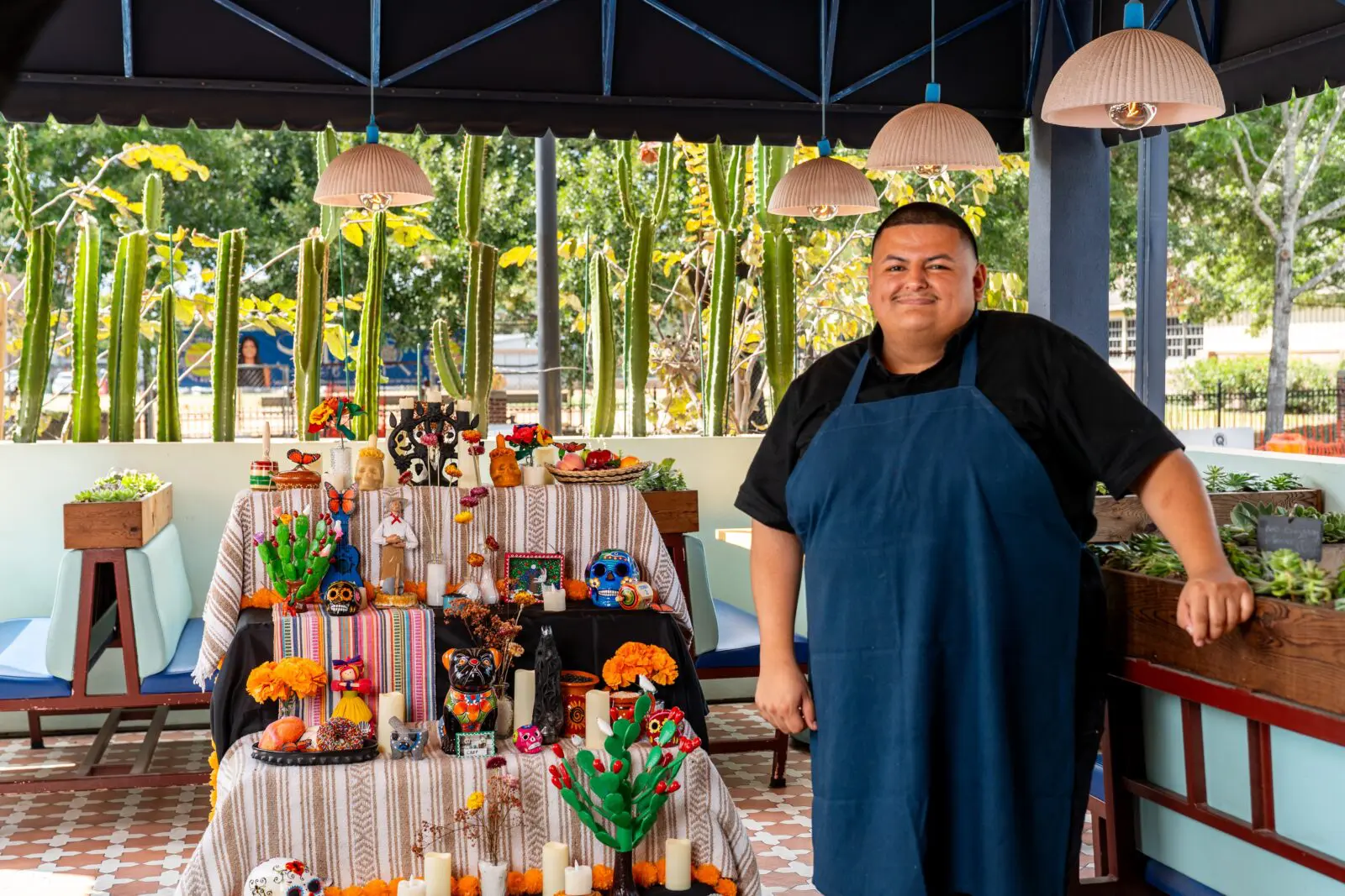 Chef Adrian Torres outside on the adjoining enclosed patio during Dia de Muertos festivities at Maximo. (Photo by Carla Gomez)