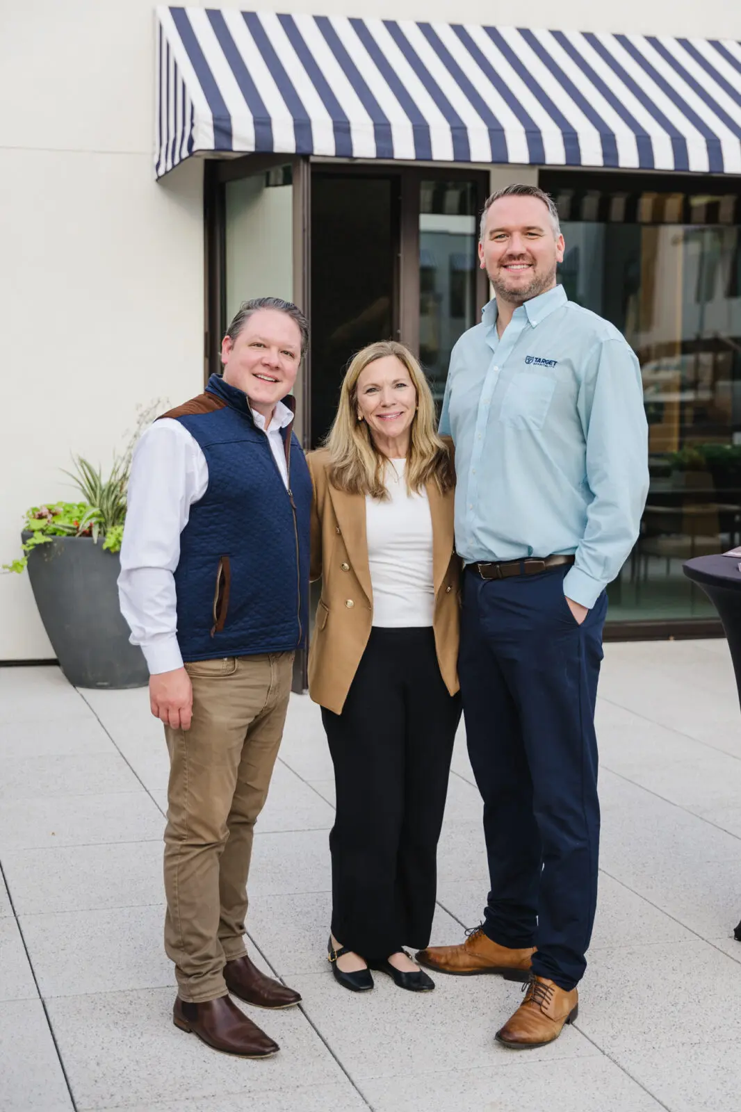Evan Berlin, Ann Wolford, Jeffery Skrabanek on the pool deck at 1 Riva Row. (Photo by Johnny Than)