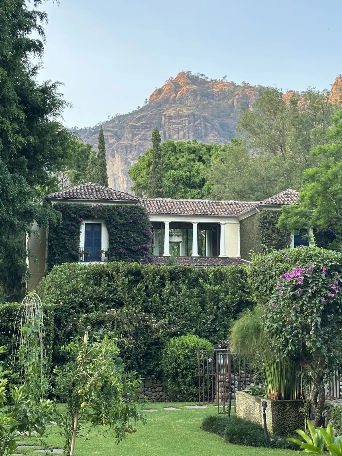 Lush gardens play foreground to the mansion as the majestic Tepozteco mountains provide a dramatic backdrop to Feronia.